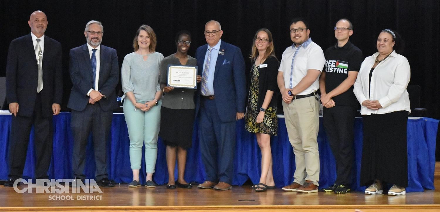  Photo of Christina School District board members, superintendent and CTE student who won award.